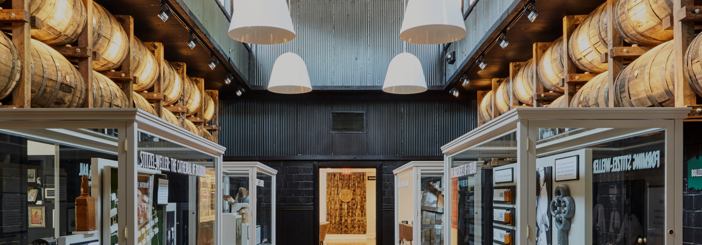 Room with artifacts from the Stitzel-Weller distillery. Mounted on the walls, large whiskey barrels.